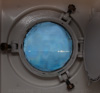 icebergs outside the porthole window - 